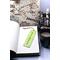 Front of bookmark, lime green background, handwritten black lettering, white and black dot art flowers, jute rope tassel.