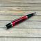 red and black jeep pen