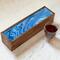 Periwinkle ribbons top this 5-compartment wooden tea box. Great for entertaining, holds up to 50 tea bags. Time for a tea party!