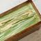 Wooden tea box with green and gold.