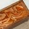 Tea chest with  fluid acrylics in orange, brown and gold.