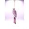 Side one of entire wind chime. White background, purple dot art, jute rope tassel, pink wind chimes with silver string.