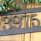 Close up of silver vein powder coat on our hanging metal address sign.