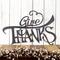 Give Thanks metal wall art with script lettering, in silver vein powder coat.