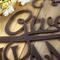 Close up of copper vein powder coat on our Give Thanks metal wall art.