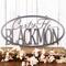Oval family name metal sign with first names and last name, in silver vein powder coat.