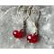 Designed with Valentines Day in mind, quality argentium silver wire is worked into hearts to which red crystal beads are attached.