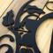 Close up of matte black powder coat on our metal monogram plaque. 