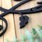 Close up of matte black powder coat on our metal monogram sign.