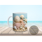 Tropical beach mug with seashell design and ocean colors.