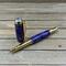 purple and gold rollerball pen