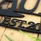 Close up of matte black powder coat on our captain name metal sign.