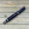 Blue resin with purple accent rollerball pen