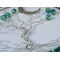 front view showing vignette background letting beautiful blue color hoop stand out standing amongst tumbled stones crescent moon accent 