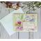 A pastel card with butterfly and floral scrapbook paper, light yellow cardstock, and a stamped sentiment with the words "rejoice" in pink.