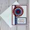 A patriotic 4th of July card with embossed cardstock, a blue ribbon with stars, handmade embellishment and a Spirit of America sentiment.
