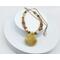 Handcrafted necklace with a yellow opal teardrop pendant, mookaite beads, brass accents, and a gold-toned stainless steel chain