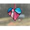 Heart-Sun ornament in direct sunlight in purple-pink
