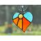 Heart-Sun ornament in direct sunlight in orange-yellow