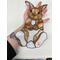 Rabbit being held for size reference.