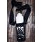 Pineapple Lace Water bottle sling/carrier in black with a full-sized water bottle. Great for hiking, day out, shopping trip, conferences.