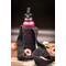 Pineapple Lace Water bottle sling/carrier in black with a full-sized water bottle. Great for hiking, day out, shopping trip, conferences.