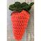Medium dark orange crochet carrot pouch with dark green top  filled to show round shape once filled. Tie can be tightened and secured.