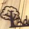 Close up of copper vein powder coat on our kid metal name plaque with oak tree.