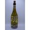Full view of bottle with fairy lights on and low lighting