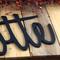 Close up of matte black powder coat on our personalized metal sign.
