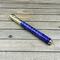 gold and purple pen