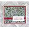 A Christmas card kit with winterberries paper, red cardstock mats, "Merry Christmas" stamped sentiments and red ribbons.