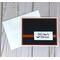 A Halloween card kit with black embossed cardstock, orange cardstock mat, 'Happy Halloween" sentiments and orange ribbons.