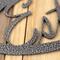 Close up of silver vein powder coat on our oval established year metal wall art.