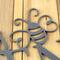 Close up of silver vein powder coat on our metal garden name sign with a bumble bee.