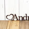 Close up of heart on our child name metal sign, in copper vein powder coat.