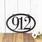 Horizontal oval 3 digit metal house number sign, in silver vein powder coat.
