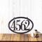 Horizontal oval 4 digit metal house number sign, in raw steel.