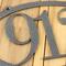 Close up of silver vein powder coat on our oval metal house number sign.