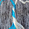 close up details of blue and silver wire tree trunk twisted together to give it a striped appearance