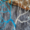 twisted wire branches shown in detail. blue and silver wire 