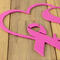 Close up of pink powder coat on our breast cancer survivor metal plaque.