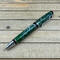 emerald green and silver cigar style ballpoint pen