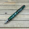 bright chrome, green, and and silver cigar ballpoint pen