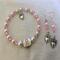 E4
Pink beads and white pearls with heart charm