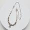 18.5-inch necklace featuring lampwork beads, Swarovski pearls, and a stainless steel pendant, set on a steel chain with silver-toned accents