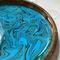 Close up of the bold ribbons of blue and green on this wooden serving tray.