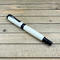 Imitation ivory and black chrome rollerball pen