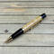 Gold pen with corn cob barrel