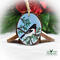 A hand-painted wood slice Christmas ornament with a rose-breasted grosbeak available for purchase at Cove Creek Photography.